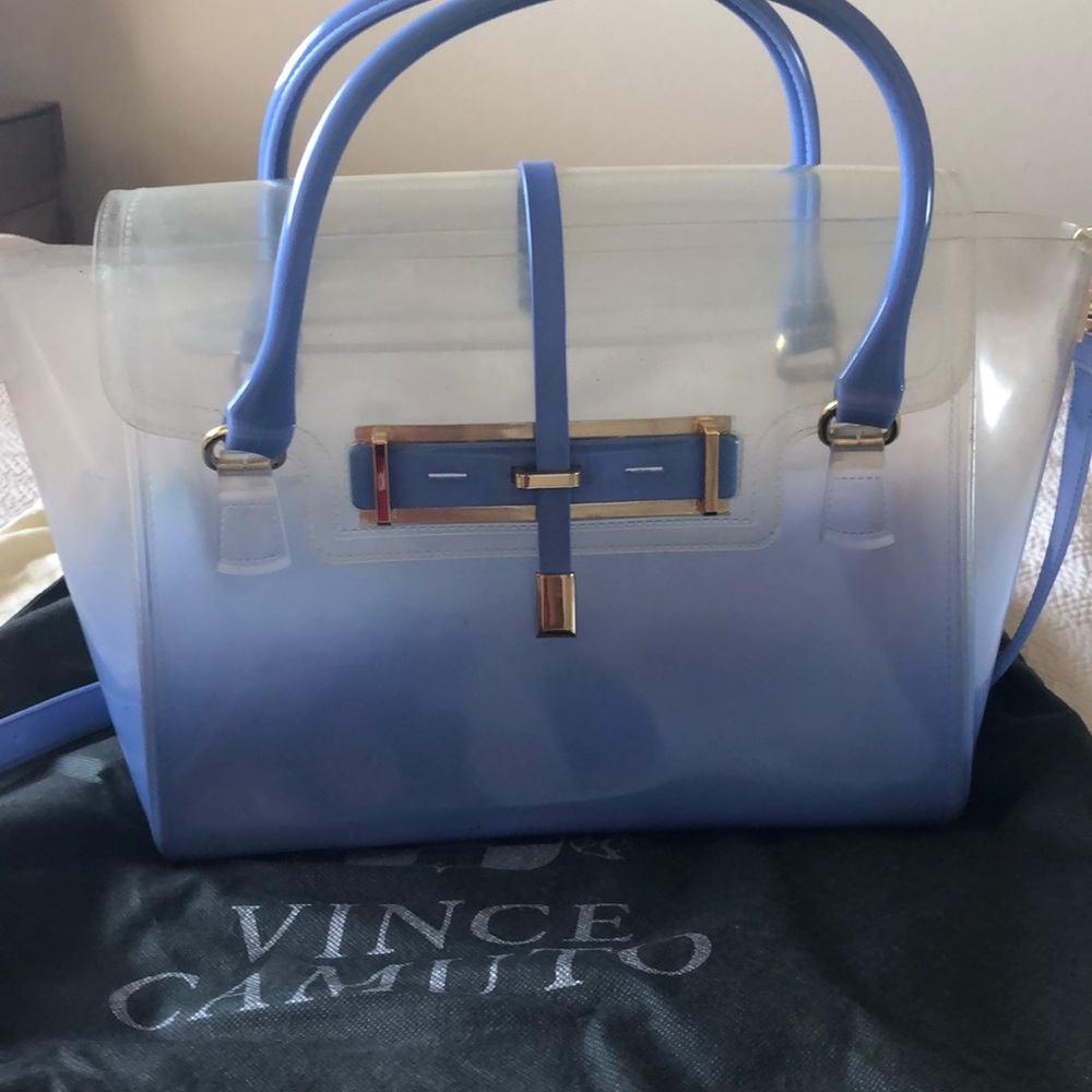 Plastic handbag with strap.